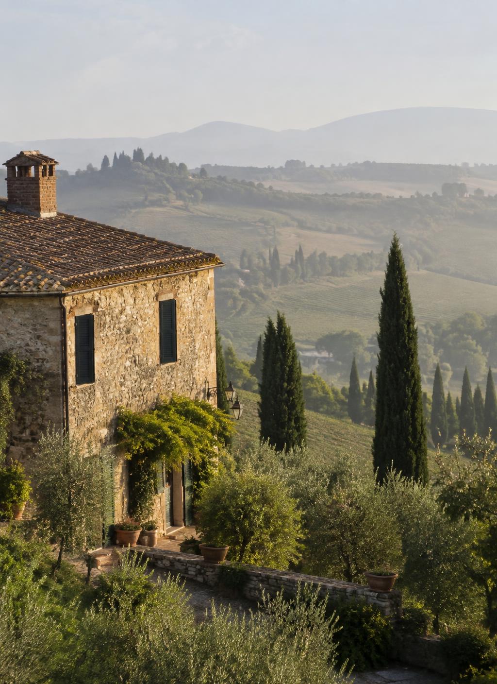 A stone farmhouse overlooking the Italian countryside in morning light